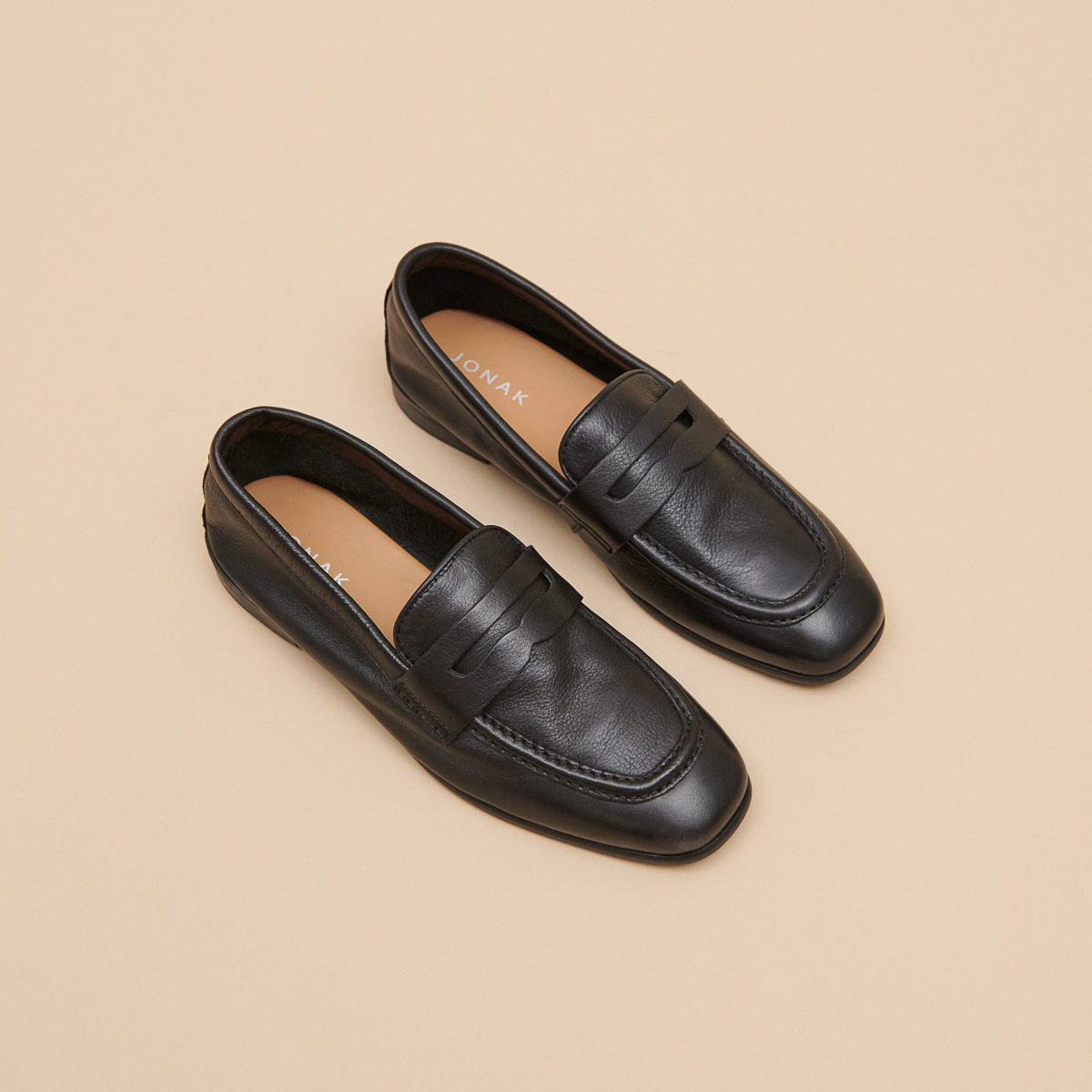 Mocassins à talons plats et bouts arrond...